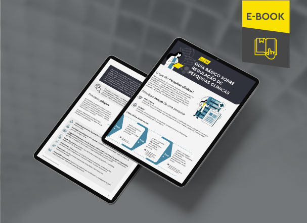 Mockup ilustrativo de dois tablets, um acima do outro, com imagens do conteúdo interno do e-book. No canto superior direito, faixa descritiva nas cores amarelo e cinza, com o nome "e-book" escrito